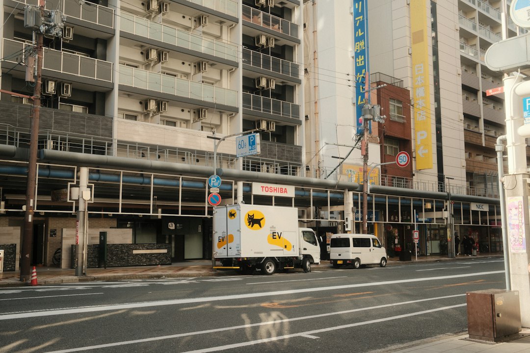 City street with buildings and parked vehicles