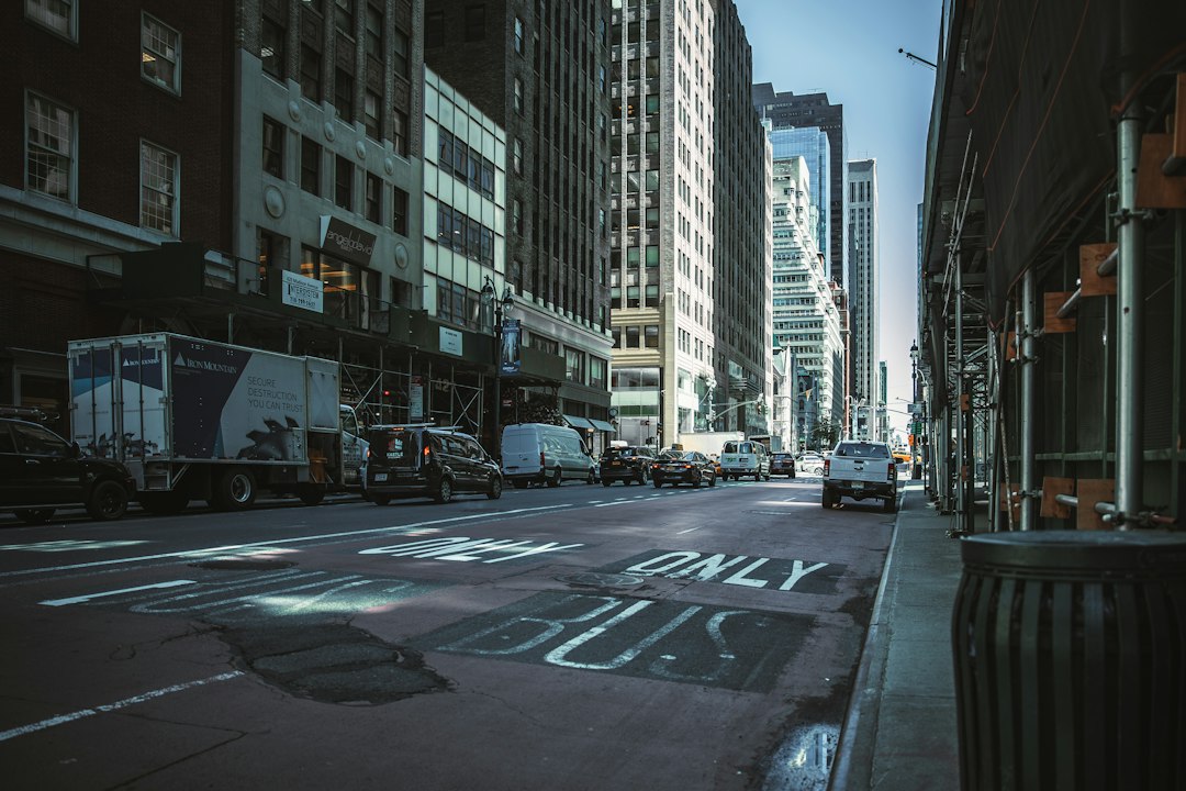 a city street with cars and trucks